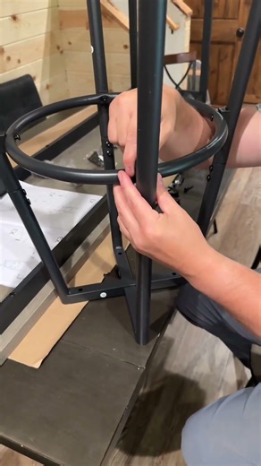 Behind the couch table & stools set