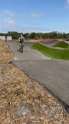The new pump track at Hidden Harbor designed and built by American Ramp Company is ready to ride and fun for all ages and skill levels. With smooth flow and banked turns, it's perfect for bike scooters skateboards and more! | Manatee County Explore and Play