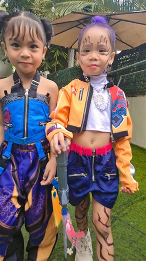 From Frozen to Fierce! ❄️🔥 Zoe & Rumi say bye to Elsa & Anna and hello to their K-pop era 💃💫 huntrix k-pop like huntrix k-cute 😅😂 k-pop fever with zoe and rumi #HuntrixMoodOn #CosplayQueens #trendingreelsvideo #reelsfbシ #foryoupageシ #holloween @highlight | Cora Paderan Petilo