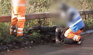 Police launch probe after HS2 worker filmed kneeling on protester.