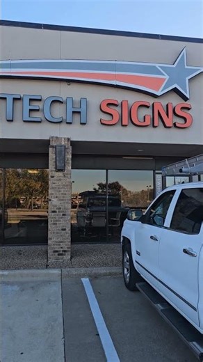 High Tech Signs works on Bert Roofing Truck