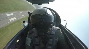 POV shot from the cockpit of a fighter plane.