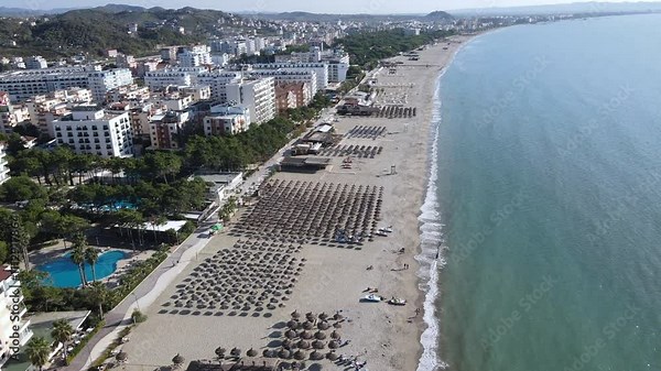 Durres, Albania 11.01.2024 View of the sandy beach and the sea. Slow flying over beautiful view of the beach and hotels. Adriatic Sea.
