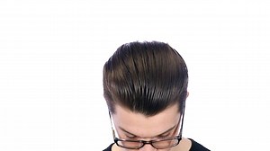 Slick back greaser hairstyle on Daniel. | TheSalonGuy