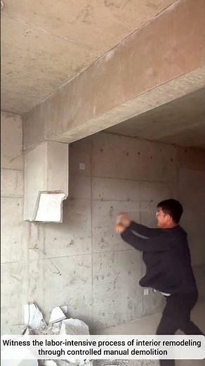 Demolition of a Concrete Wall Using a Sledgehammer
