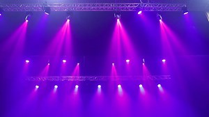 Stage lighting fixtures, blue, purple and pink lighting.