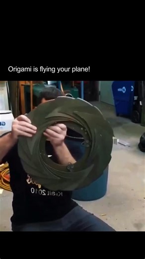 AI News | Tech | Human Impact on Instagram: "This video shows how something as ancient as origami is quietly shaping the future of advanced engineering. What you are looking at is an iris mechanism, a device inspired by folding principles and used in aircraft engines to precisely control airflow. It works much like a camera aperture, using overlapping curved panels that expand and contract around a central opening. In aircraft engines, this mechanism plays a critical role in temperature regulati