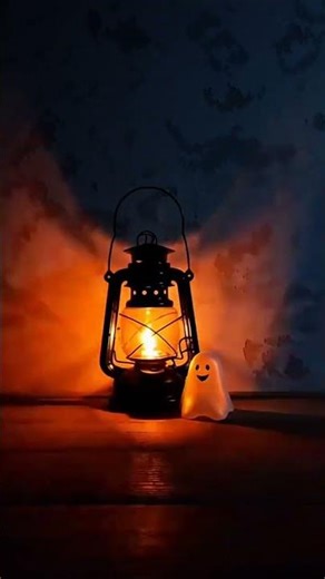 Lantern-lit cozy spooky corner with a tiny ghost at night 🪔