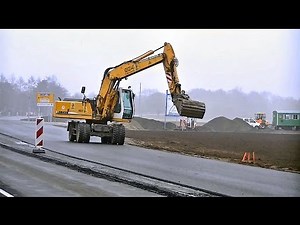 Mobilbagger Liebherr A904 Litronic im Strassenbau / Wheeled excavator Liebherr A904 Litronic