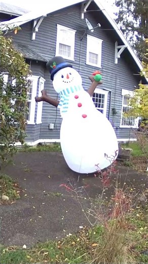 Inflatable snowman struggles captured on a Blink camera