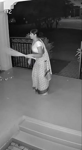 Terrifying Night CCTV Leopard Jumps Over Gate and Startles Woman Sweeping!