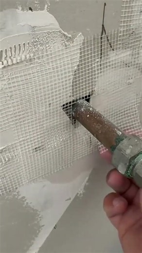 The white cement plastering process, covering gaps and holes using construction mesh. #popular