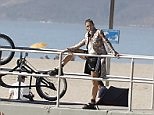 Cindy Crawford looks years younger as she models on the beach