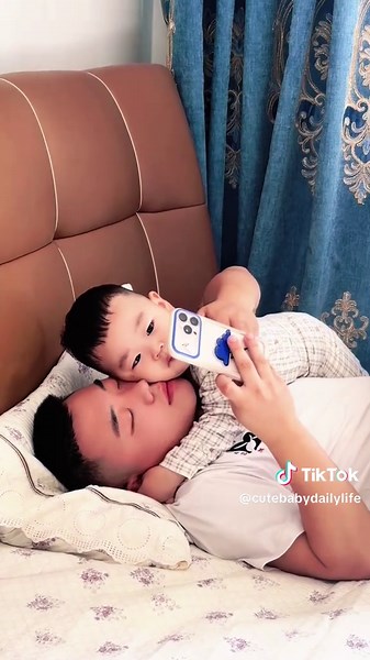 Family of Three Snuggled in Bed — Cozy Baby Moments
