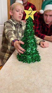 8.4K views · 63 reactions | The Christmas Tree Ball Game  Kids, Dad, and family play Christmas party game with cups, ping pong balls, and christmas tree decorations. (for entertainment purposes only)  This video was produced by Network Media and Benson Bros | Stage Left Productions | Facebook