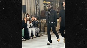 Cardi B Wears Rubbery Black Leather Dress at Paris Fashion Week