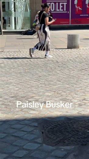 Paisley busker at piazza #paisley #busker #musician #music #guitar #playing #playingsolo #shopping