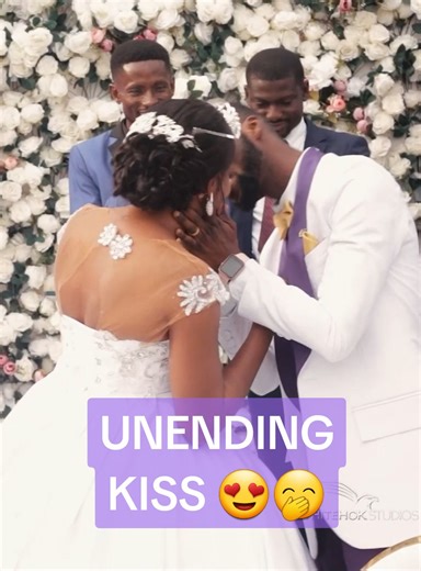 Endless Kisses: A Heartwarming Wedding Moment