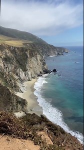 PAN SLOW MOTION - Bixby Creek Bridge, also known as Bixby Canyon Bridge, on the Big Sur coast of California, USA. It is a reinforced concrete open-spandrel arch bridge.
