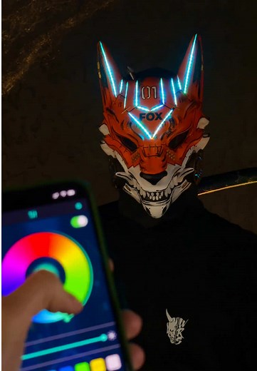 Cyberpunk mask: Fox 01 with RGB LED lights 🦊 Our cyberpunk mask is fully handmade from high-strength resin, and hand-painted with acrylics. Inside, it has soft padding for comfort and a wide strap with elastic bands for a secure fit. The mask features smart RGB LED lighting. You can control the colors and effects through an app on your phone, sync the lights to music, or adjust brightness and modes with a remote controller. The LEDs are powered by a portable power bank. Two built-in fans help w