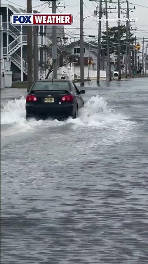 Water washes over road in Wildwood, New Jersey as nor'easter approaches