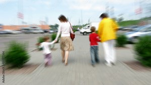 Family goes from parking place. Time lapse.