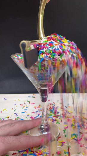 Satisfying Sprinkles Pouring into a Martini Glass