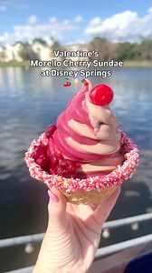 Valentine's Morello Cherry Sundae at Disney Springs.🍒 DOLE Whip Cherry, chocolate-soft-serve. Sprinkles, Morello cherry sauce, topped with a cherry and served in a waffle bowl. Located at Swirls on the Water. #disney #disneyfood #disneysprings #disneyworld #disneysnacks | Pixiedustedfun