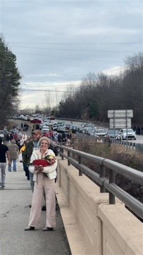 People waiting at Yadkin Bridge for the Buddhist monks. | WFMY News 2