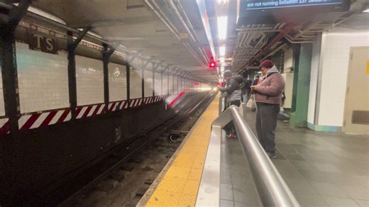 R188 7 express train arriving at 42
