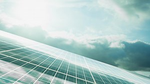 Download Solar Cell Reflection of A Cloudy Blue Sky with Sunrise for free