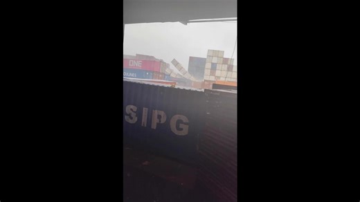 Shipping containers topple over like giant Jenga tower