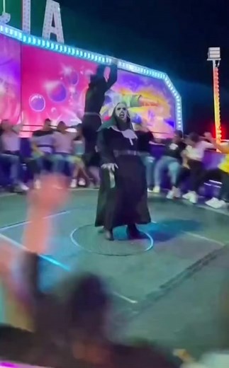 Spinning Ride with Nun and Jigsaw Puppet at Amusement Park