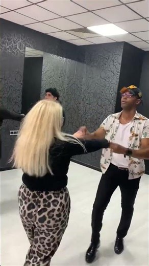 salsa routine partner teaching with students