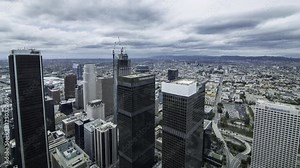 Time lapse of aerial cityscape overview of Los Angeles during winter storm in the daytime