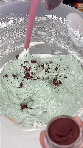 Coloring macarons with green powdered food coloring for the perfect vibrant shade.#Macarons #Baking