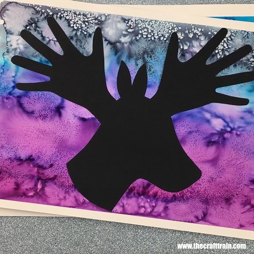 Turn gorgeous watercolour and salt painting into handprint silhouette holiday art using our templates https://www.thecrafttrain.com/christmas-handprint-art/ | The Craft Train