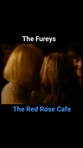 "The Red Rose Cafe" refers to a nostalgic Dutch song by Father Abraham, originally titled "Het kleine café aan de haven" (The Little Café by the Harbour), that was popularized by The Fureys. The song celebrates the warmth and community of a small harbor-side café where people from different walks of life gather to share stories, find respite, and enjoy moments of togetherness, symbolizing resilience and life's simple joys. | Irish Ballads