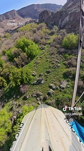 Motorcycle Cliff Jump with Parachutes: 360° View