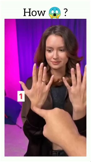 Fact Flick on Instagram: "This viral Instagram reel showcases a classic finger-counting illusion that tricks the brain in just seconds. In the short clip, a man appears to count 11 fingers across a woman's two hands-even though only 10 fingers are visible. The caption draws viewers in, inviting them to pause, rewind, and decode how the illusion works. The secret lies in visual misdirection and selective attention. During a quick camera pan, the woman subtly lifts her middle finger on the second 