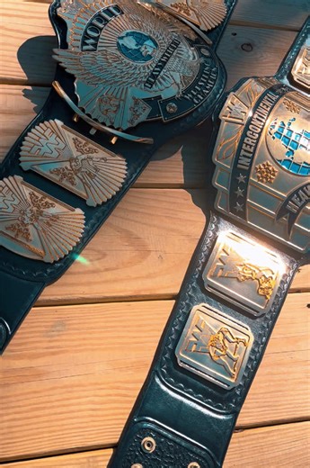 Authentic Winged Eagle and Intercontinental championship belts on fresh leather by #mnbelts. These are older belts that have been releathered by Mike Nicolau. #davemillican #reggieparks #wwe #wwf #fwf #titlebelt #smackdown #johncena #therock #codyrhodes