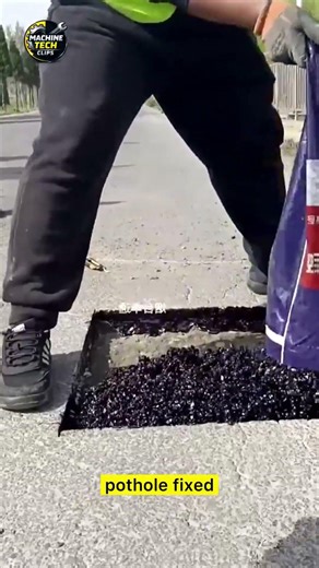 Roads pothole using silicon asphalt cold patching Road repair construction: Workers quickly repair
