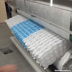 This machinery easily unbales roll packed pocket spring units via Atlanta Attachment Company | Interesting Engineering