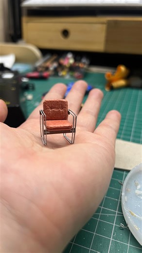 Mylyn Nguyen on Instagram: "These 1970’s Harry Ramler Occasional Chairs are made out of paper… in order of appearance: 1.2mm box board (seat cushions and wooden braces) 250gsm kraft cardboard (seat back) Strathmore toned grey paper 118gsm (arms) Washi origami paper (seat covers) And of course these are the tools I used: Screw punch Kokuyo true measure steel ruler Tamiya craft knife Needle point tool Ball stylus Lockable tweezers Selleys Aquadhere PVA Wood Glue Gouache paint The chairs are about 