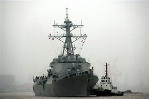 China warns US Navy after ship sails by Chinese-built island