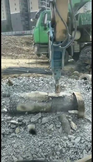 The breaker hammer on the excavator is used to break up rocks and concrete.
