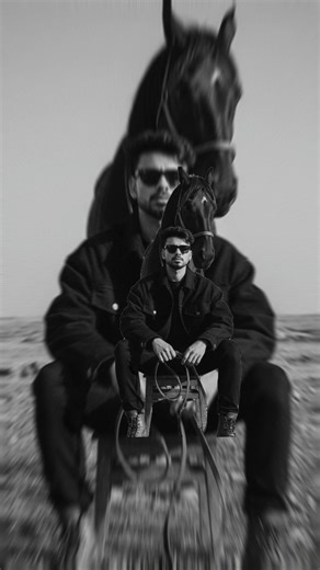 Arvind Singh Rathore on Instagram: "Prompt for 👇.................... My Face should be Same in this introverted expression. The subject is wearing dark oversized layered clothing, wide-leg pants, leather shoes, and dark sunglasses. A sturdy maroon horse stands close behind the seated figure, safely aligning and partially overlapping the subject's silhouette. The open natural landscape with rough terrain and wild grass, and a bright overexposed sky create strong negative space. High contrast lig