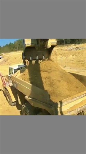 Massive CAT 365C Excavator Loading Articulated Dump Truck in Action!