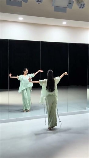 Leap into Green: A Flirty Somersault Dance in a Green Robe