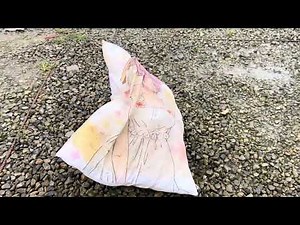 Two girls trample anime pillow
